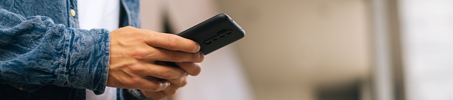 hand view of a person using his phone