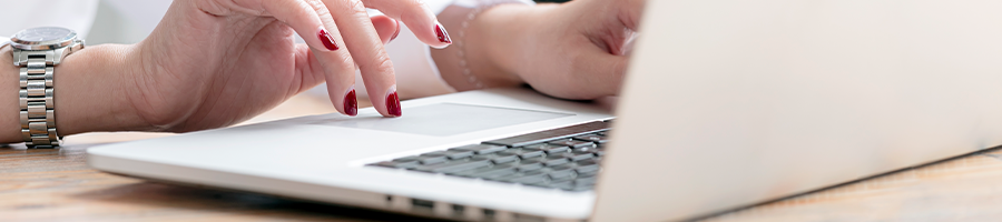 hand view of a woman using her portable computer