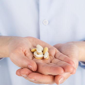 handful of supplement pills