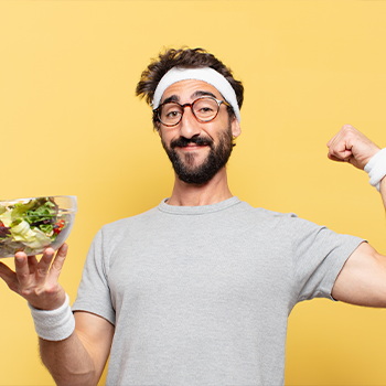 man showing his salad and biceps