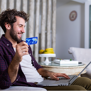 man with his credit card and laptop