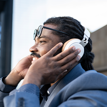 man smiling while listening to music