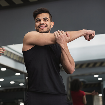 man stretching his arms