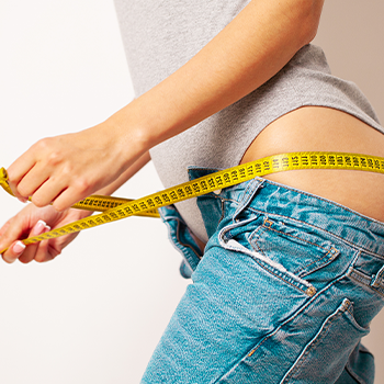 woman with a tape measure on her body