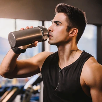 Man Drinking water after workout