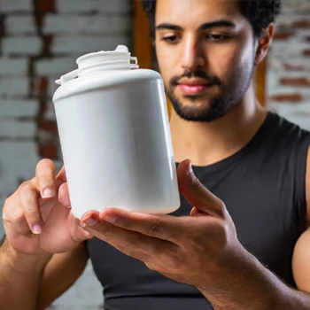 A guy checking the sodium level in a protein powder