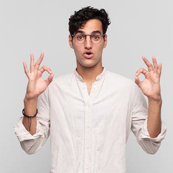 man holding up two okay signs