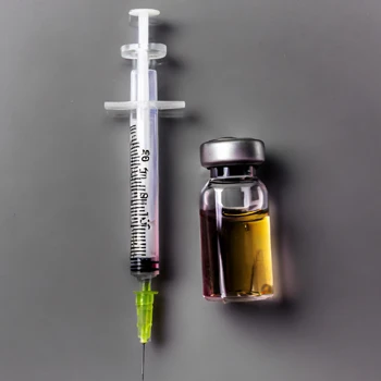 Syringe and testosterone bottle