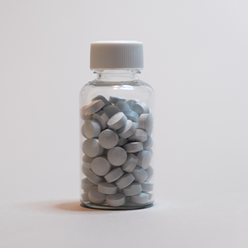 bottle of grey capsules
