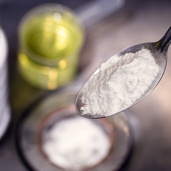 white powder filling a silver spoon