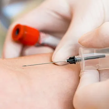 inserting an injection into skin