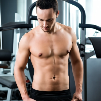 Portrait image of a man with fit body while looking down