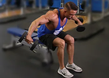 Man doing Seated Dumbbell Rear Fly