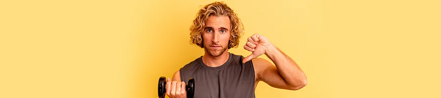 man with a dumbbell giving a thumbs down