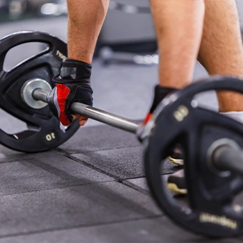 man using a barbell