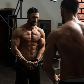 shirtless man in the gym