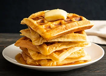 stack of waffles with butter