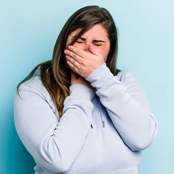 woman disgusted with smell