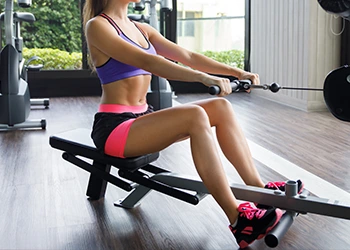 woman in a seated cable row position