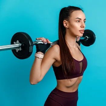 woman using a small barbell