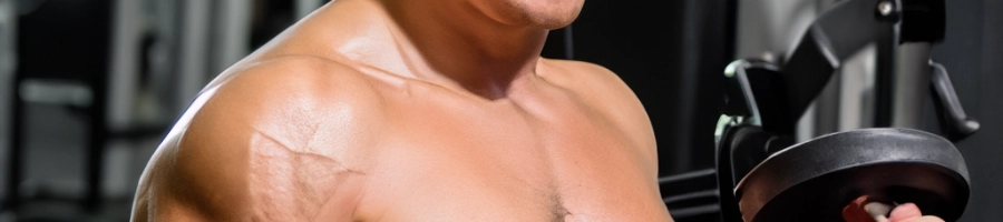 Close up look of a muscular man in the gym
