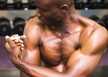 man using a syringe on himself