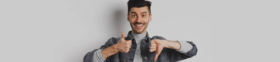 A man doing a thumbs up and a thumbs down with both hands