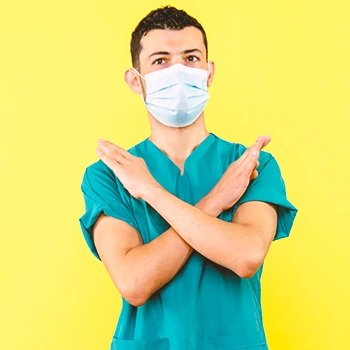 A health worker crossing his arms