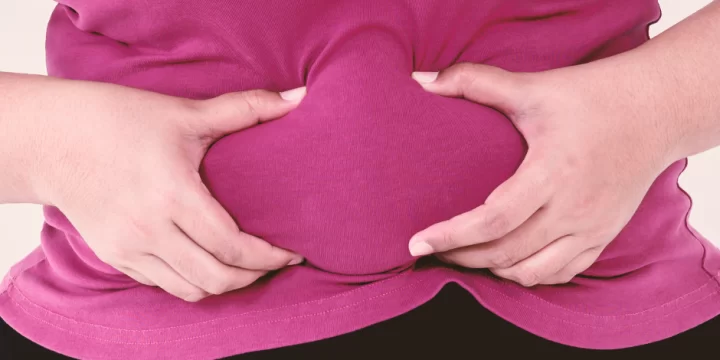 Woman squeezing her belly