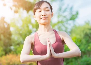 Woman outdoors doing yoga pose