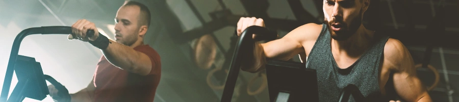 Two men in the gym excercising