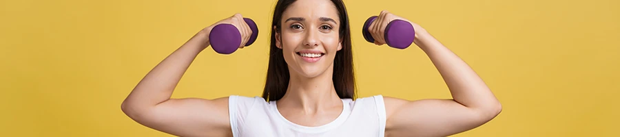 Woman holding two dumbbells