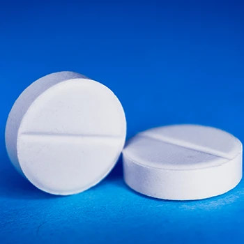 Close up image of white circular pills