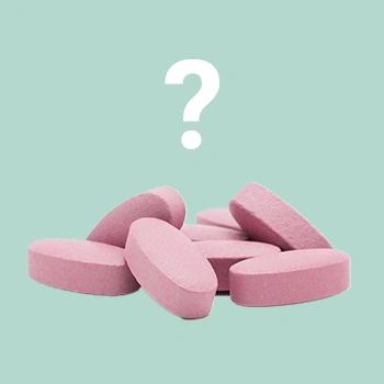 Pink pills with question mark on top
