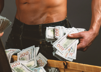 A muscle man holding money