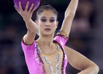 A gymnast performing close up image