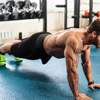 A person doing arm and chest workouts at the gym