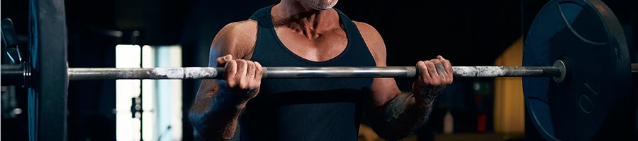 Old man lifting barbell