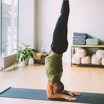 A fit man doing a handstand