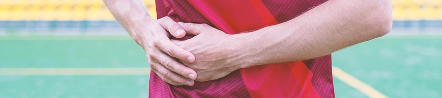 A man holding his liver