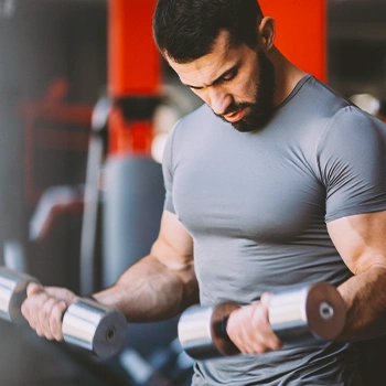 A muscular man lifting weights