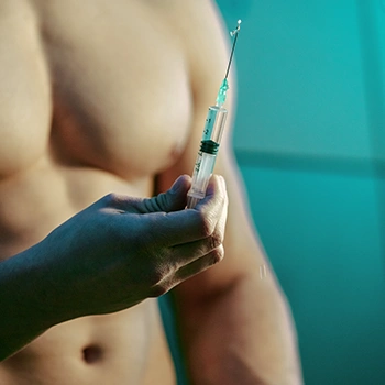 Holding a small syringe