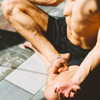 A lean person doing yoga