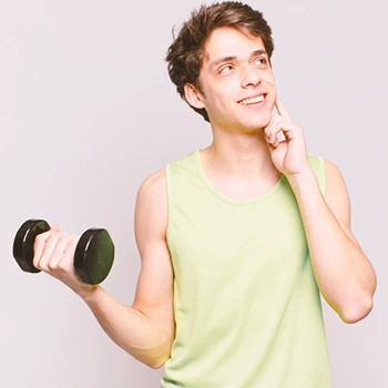 A man thinking while holding weights