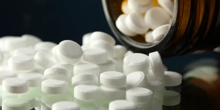 Spilled circular white pills