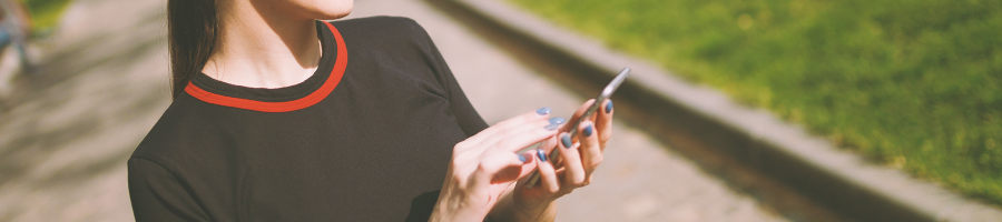 A person using her phone outside