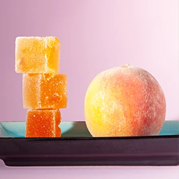 A peach and sugar cubes