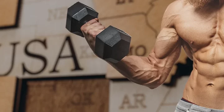 A fit person lifting a dumbbell with USA background