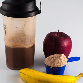 A scoop of pre workout supplement with apple