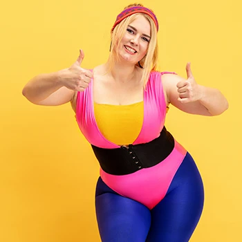 Woman in fitness attire giving thumbs up